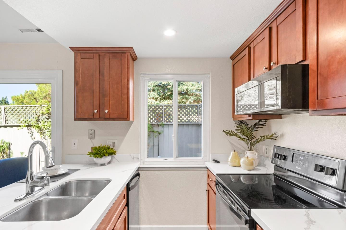643 Foster Court, Unit 4 Hayward, CA 94544 - Photo 7 of 20 a kitchen with stainless steel appliances a sink a stove a counter space and a window