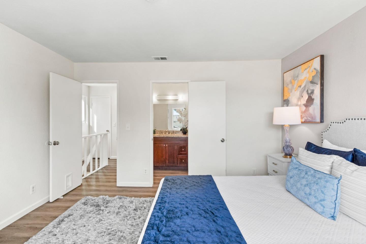 643 Foster Court, Unit 4 Hayward, CA 94544 - Photo 10 of 20 a spacious bedroom with a bed and a walk in closet