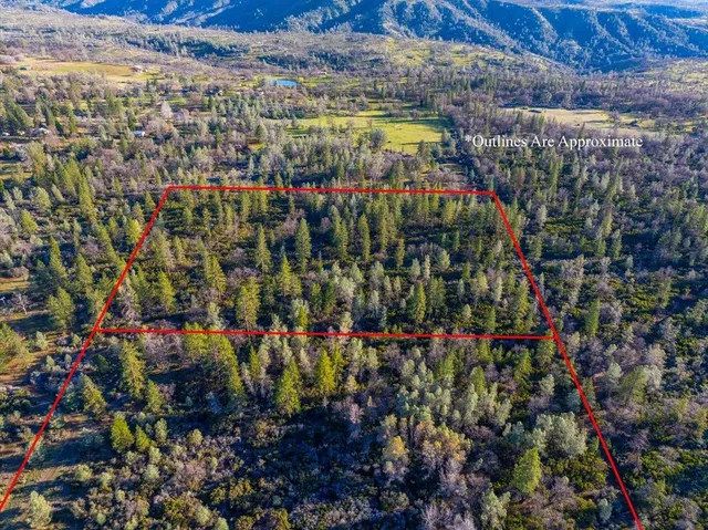 a view of swimming pool with an outdoor seating and yard