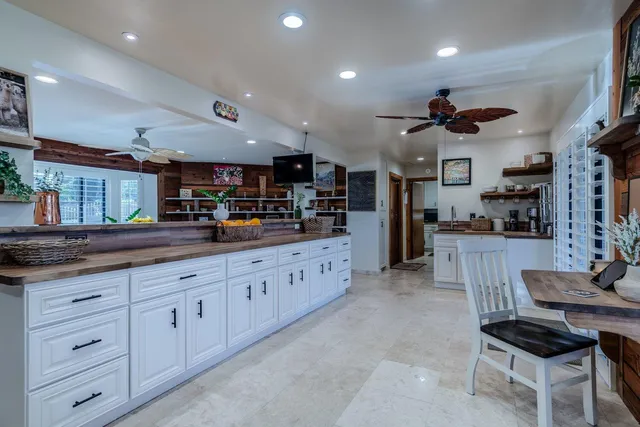 a bathroom with a toilet a sink and a window