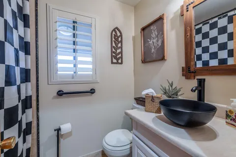 a kitchen with stainless steel appliances granite countertop a stove a sink dishwasher and a refrigerator