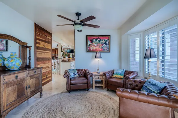 a living room with furniture and a large window