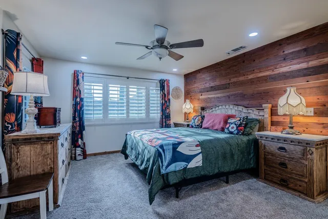 a bedroom with a bed and furniture