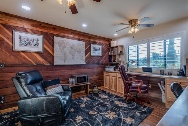 a view of a house with a yard and sitting area