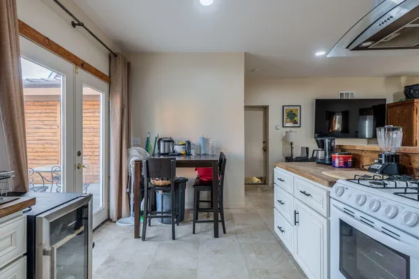 a kitchen with stainless steel appliances granite countertop a sink stove and cabinets