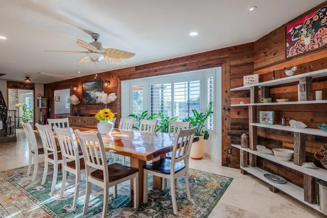 a view of kitchen with stainless steel appliances kitchen island granite countertop a stove top oven a sink and a island