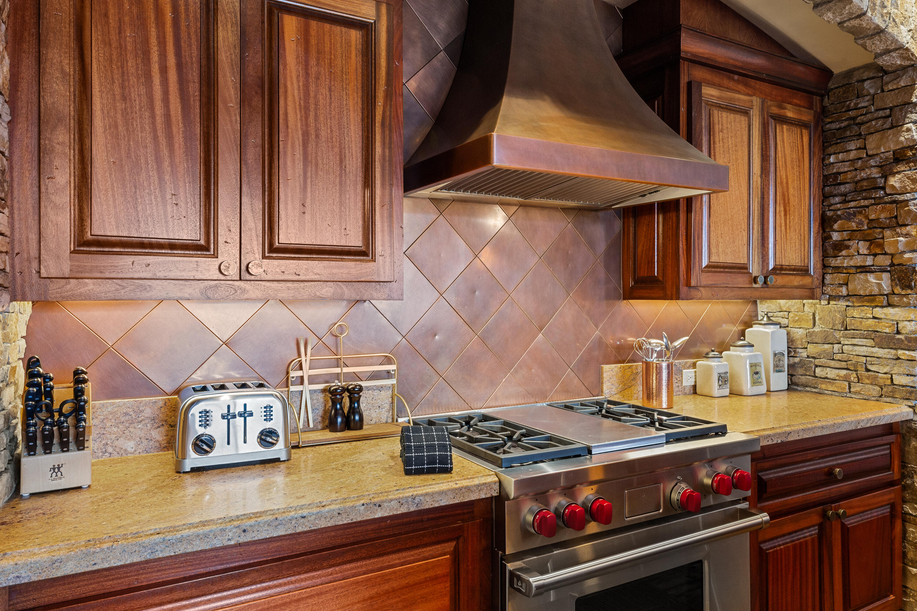 117 Sunny Ridge Place, Unit 124 Mountain Village, CO 81435 - Photo 18 of 27 a stove top oven sitting inside of a kitchen