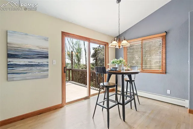 a view of a dining room with furniture window and outside view