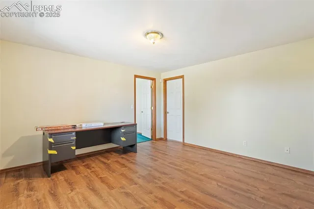 a view of workspace with wooden floor