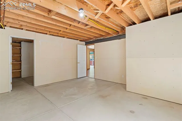 a view of a room with wooden walls