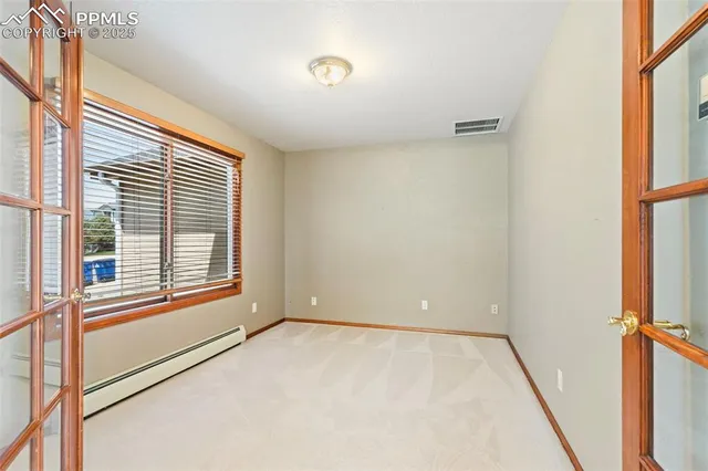 a view of an empty room with a window