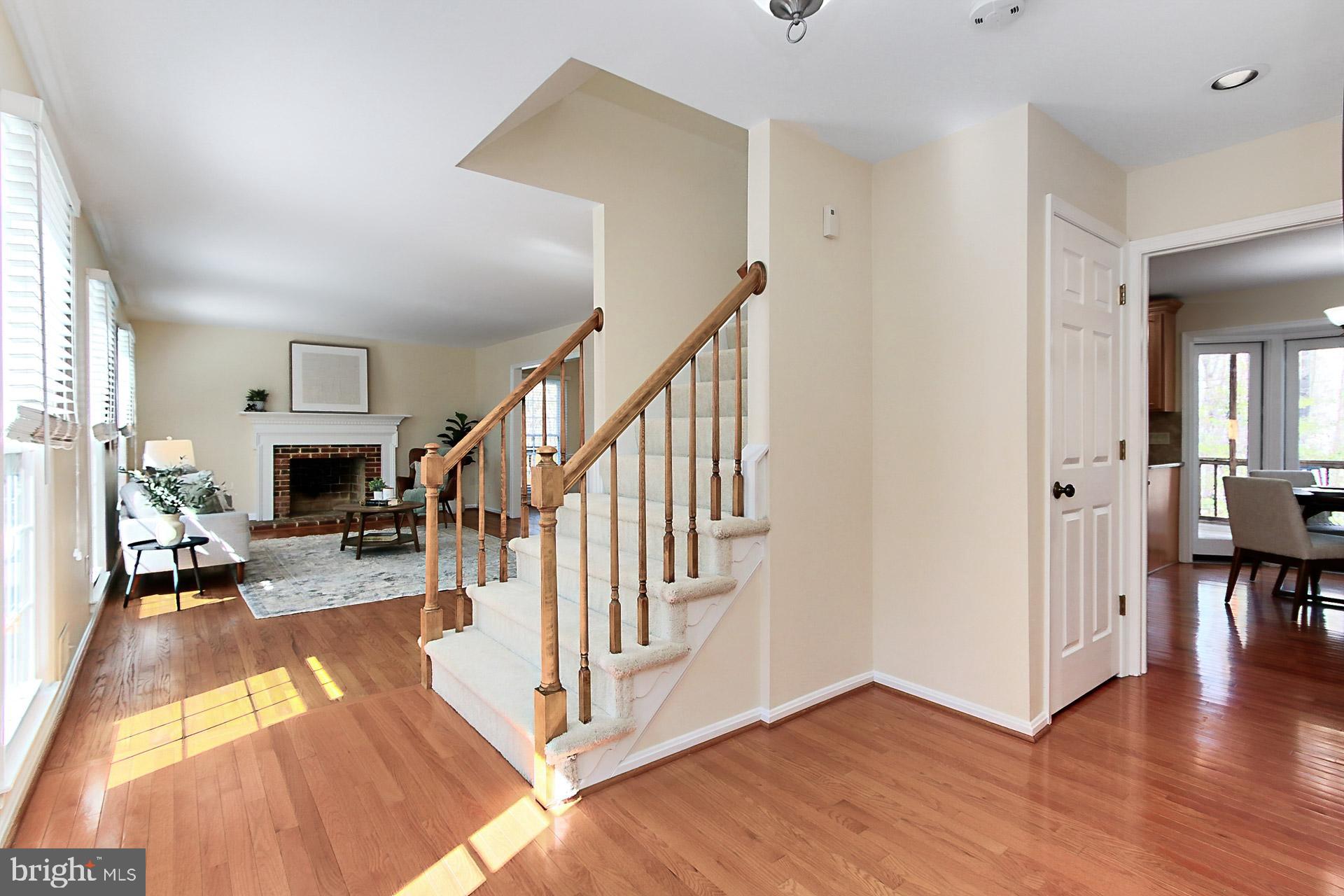 10704 Cross School Road Reston, VA 20191 - Photo 13 of 56 a view of a livingroom with wooden floor and staircase