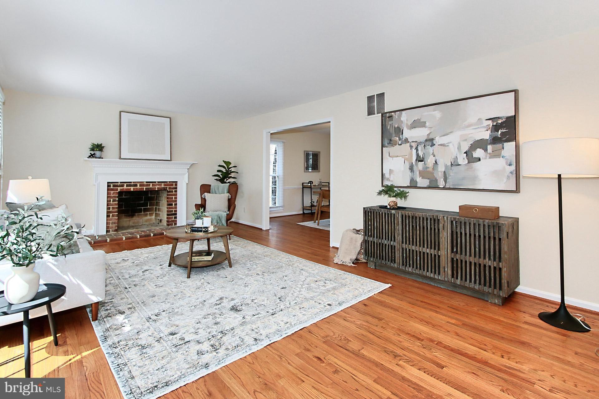 10704 Cross School Road Reston, VA 20191 - Photo 14 of 56 a living room with furniture and a fireplace