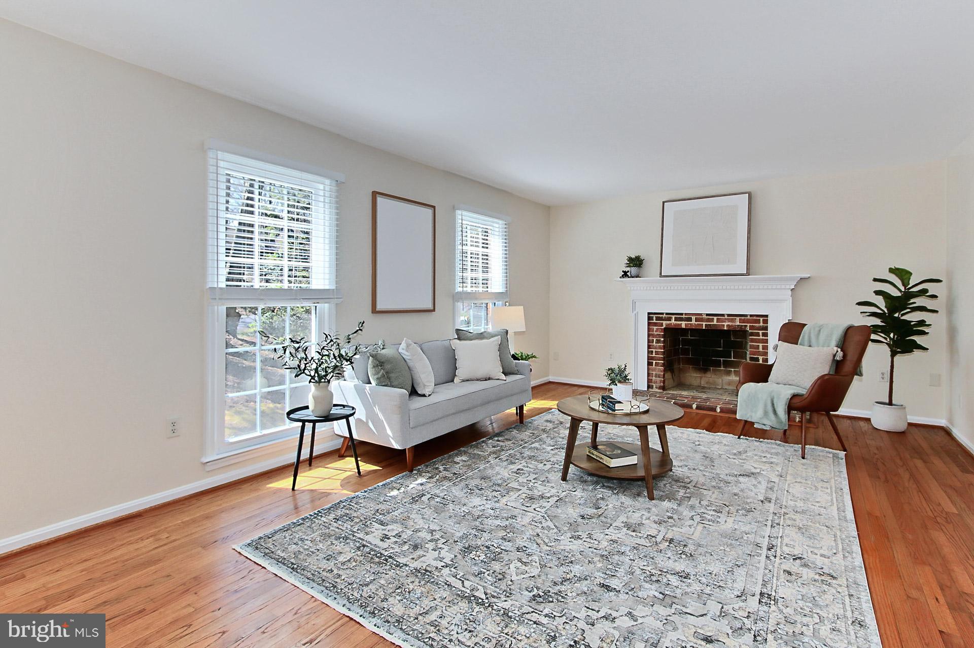 10704 Cross School Road Reston, VA 20191 - Photo 15 of 56 a living room with furniture and a fireplace