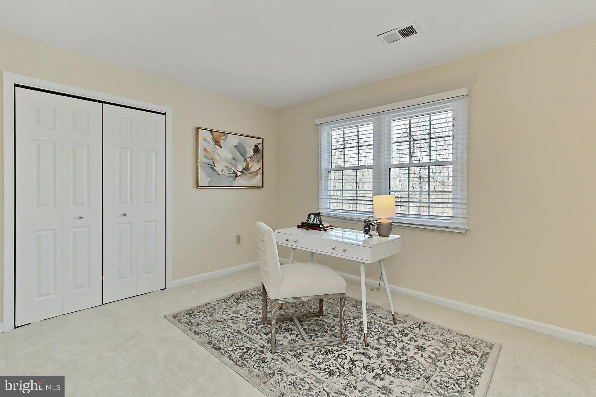 10704 Cross School Road Reston, VA 20191 - Photo 27 of 56 a view of a workspace with furniture and a window
