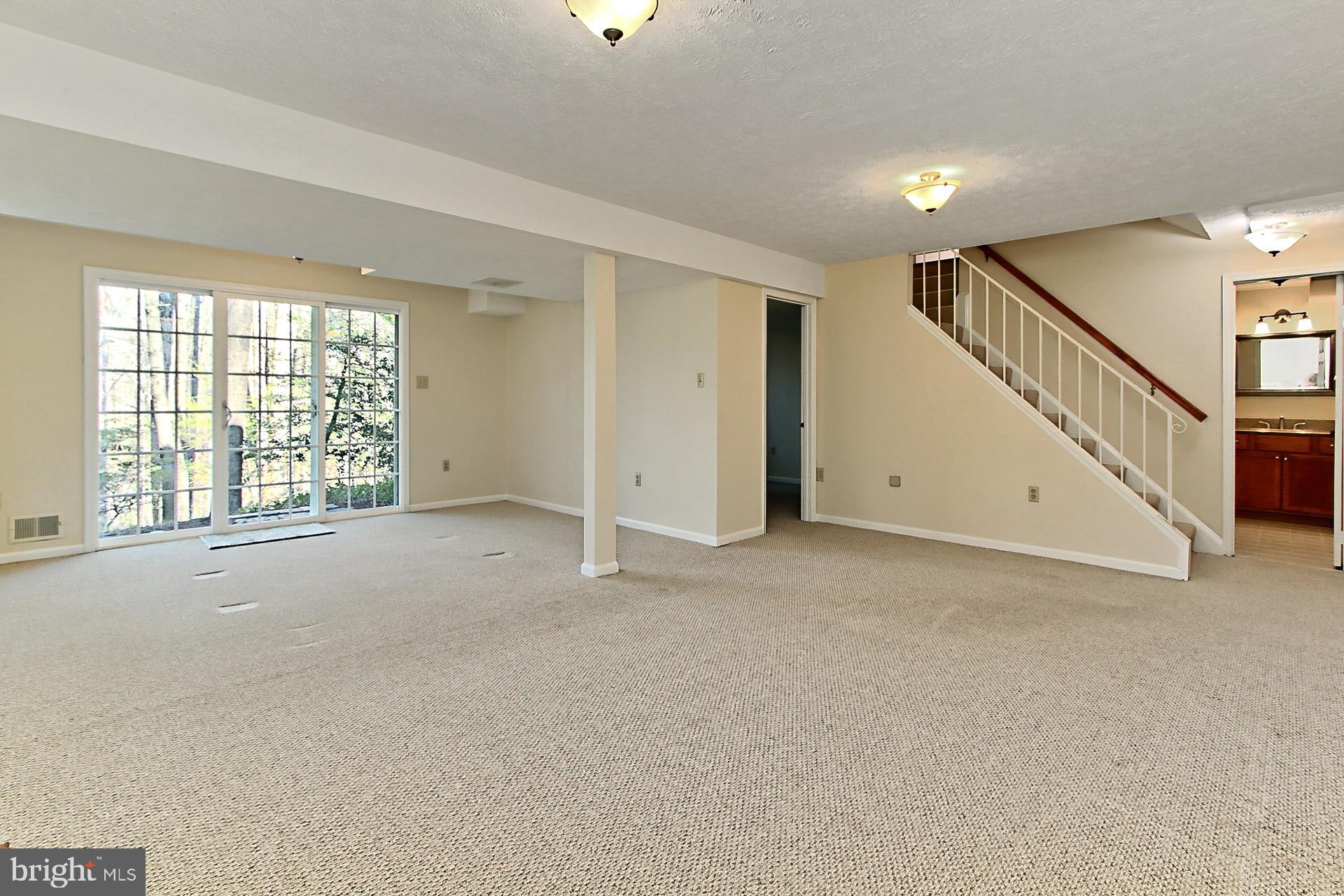 10704 Cross School Road Reston, VA 20191 - Photo 32 of 56 a view of an empty room with a window
