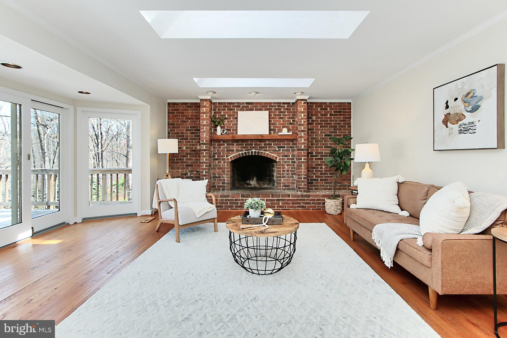10704 Cross School Road Reston, VA 20191 - Photo 8 of 56 a living room with furniture and a fireplace