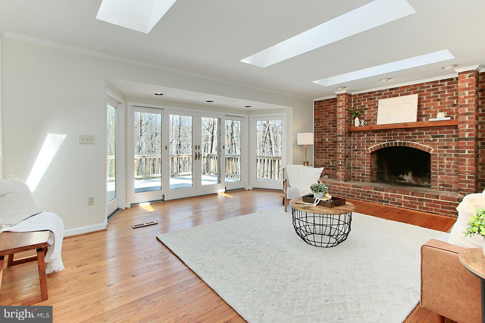 10704 Cross School Road Reston, VA 20191 - Photo 9 of 56 a living room with furniture and a fireplace