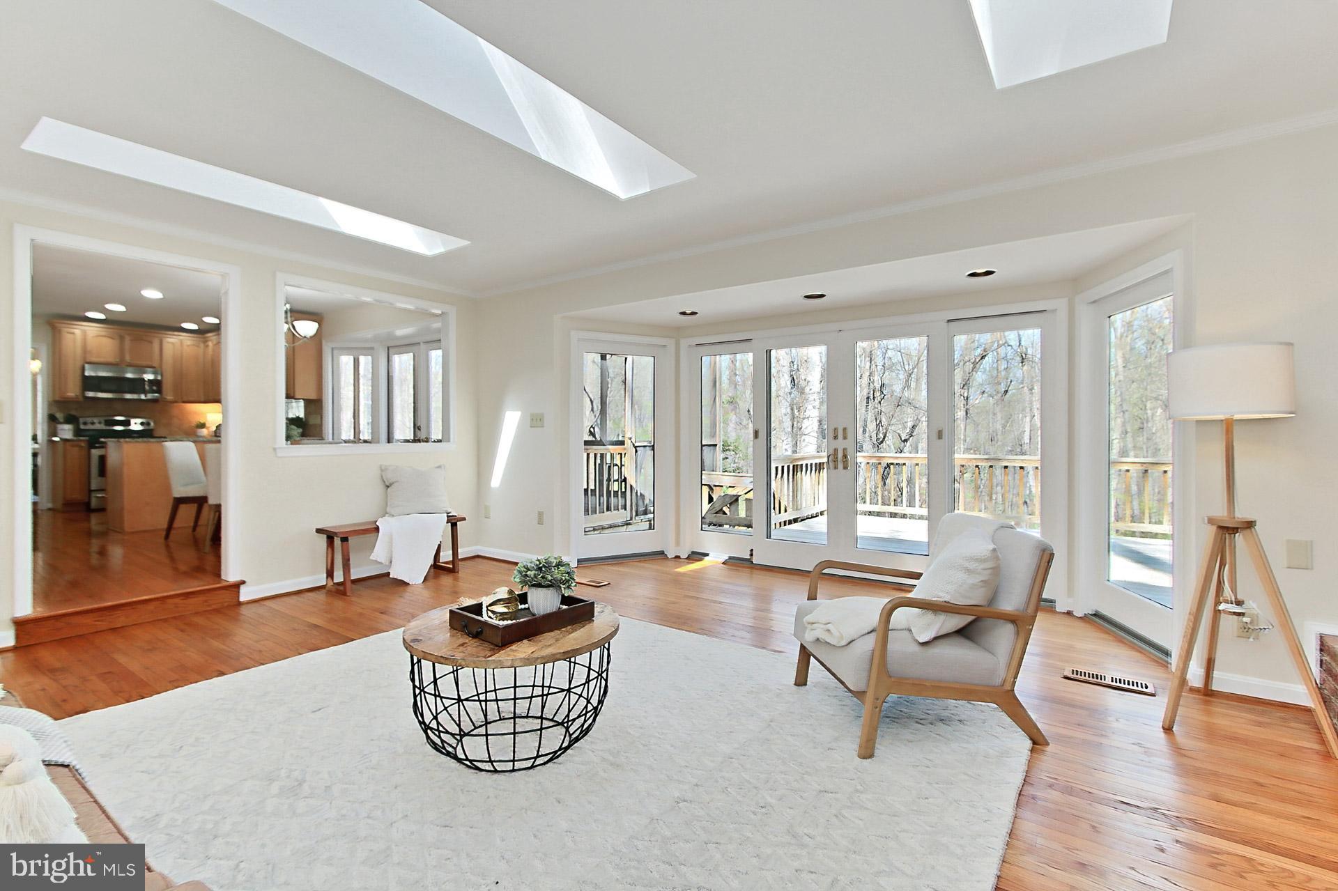10704 Cross School Road Reston, VA 20191 - Photo 10 of 56 a living room with furniture and a large window