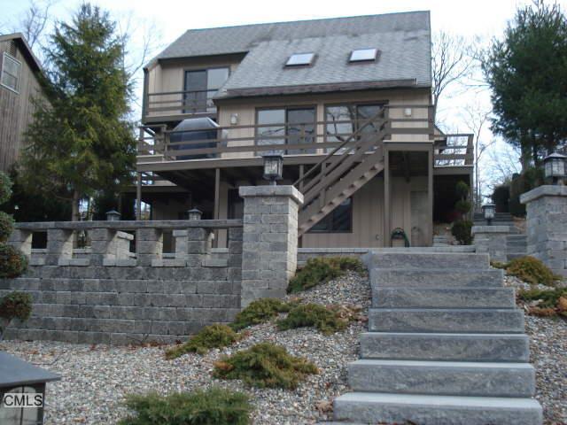 11 Boulder Ridge Danbury, CT 06811 - Photo 1 of 1 a front view of house with a garden