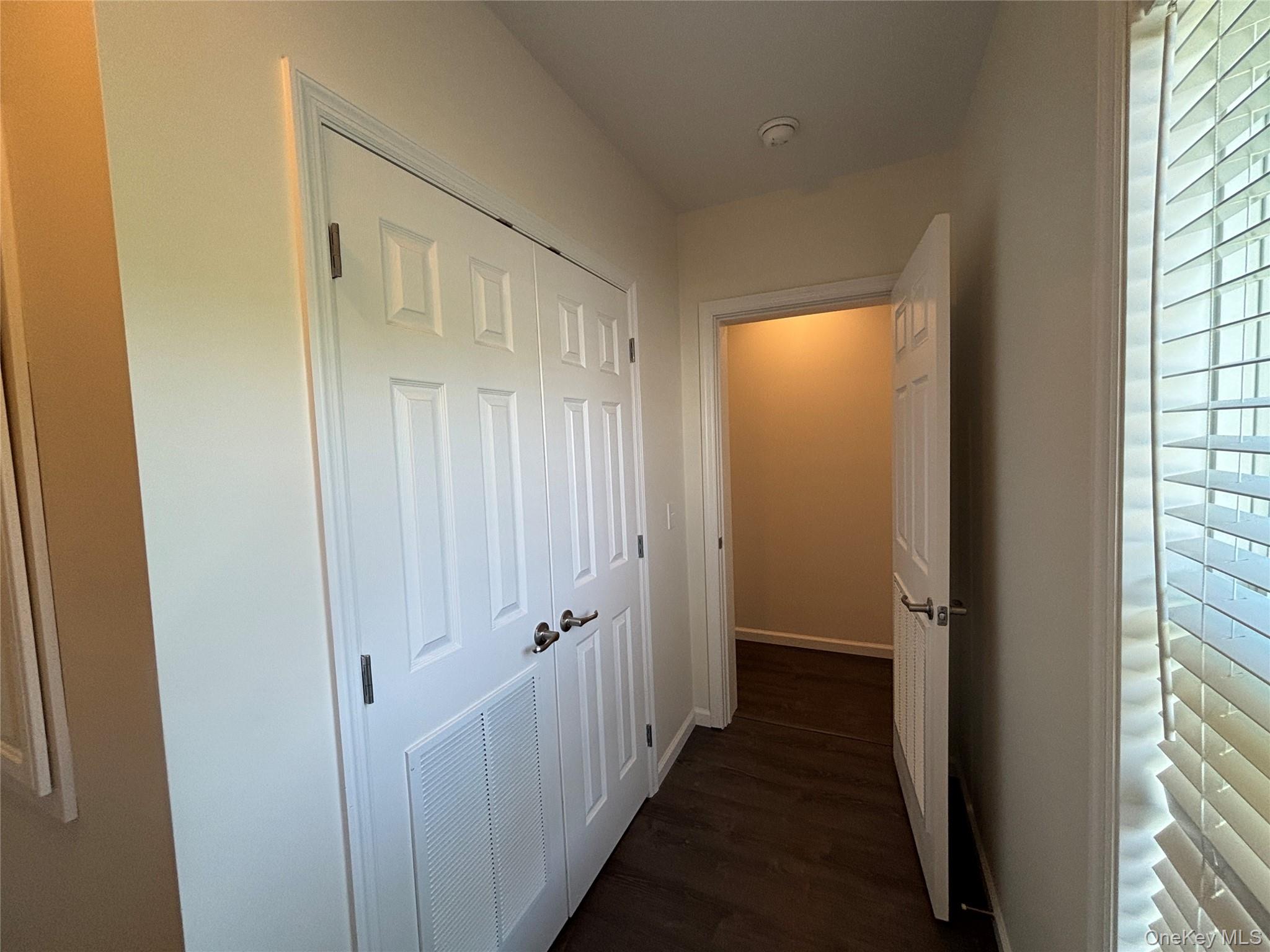 1661 Old Country Road, Unit 563 Riverhead, NY 11901 - Photo 26 of 43 a view of a bathroom from the hallway