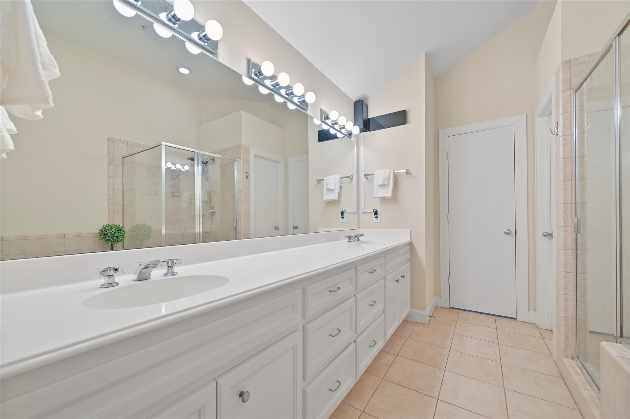 8715 Meadowcroft Drive, Unit 1002 Houston, TX 77063 - Photo 15 of 24 a spacious bathroom with a double vanity sink mirror and double