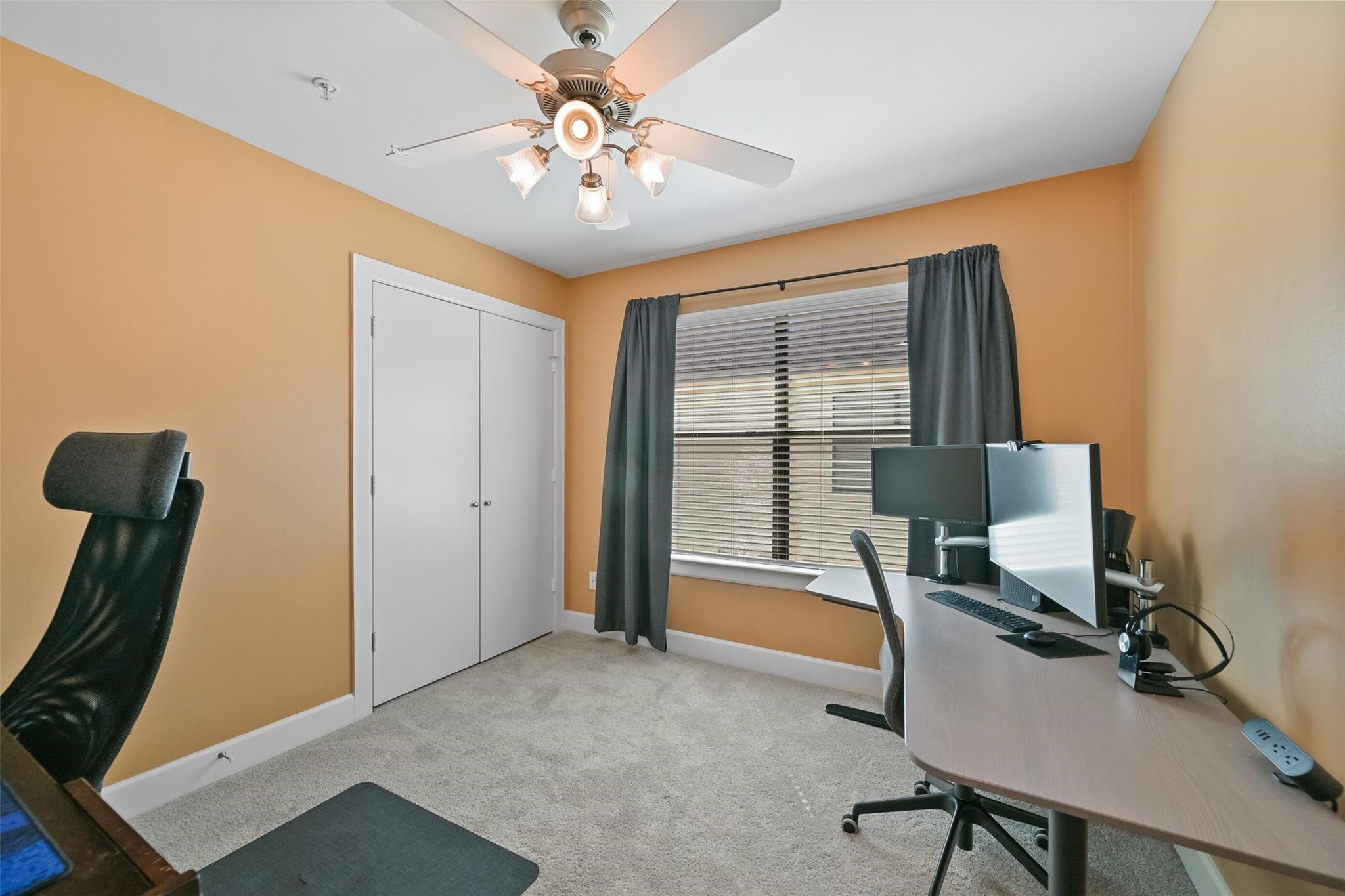 8715 Meadowcroft Drive, Unit 1002 Houston, TX 77063 - Photo 18 of 24 a view of a workspace with furniture and a window