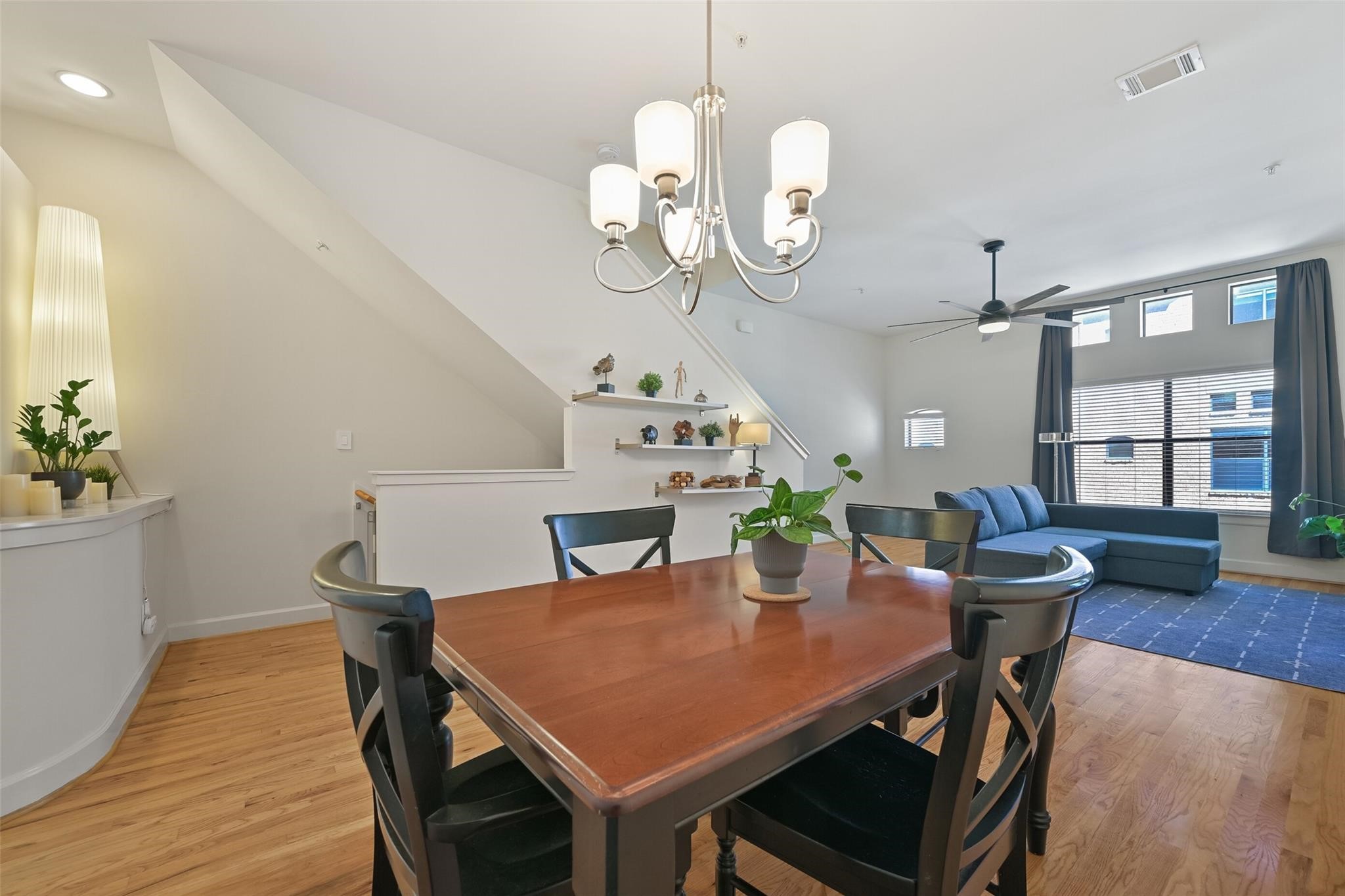 8715 Meadowcroft Drive, Unit 1002 Houston, TX 77063 - Photo 7 of 24 a view of a dining room with furniture and wooden floor