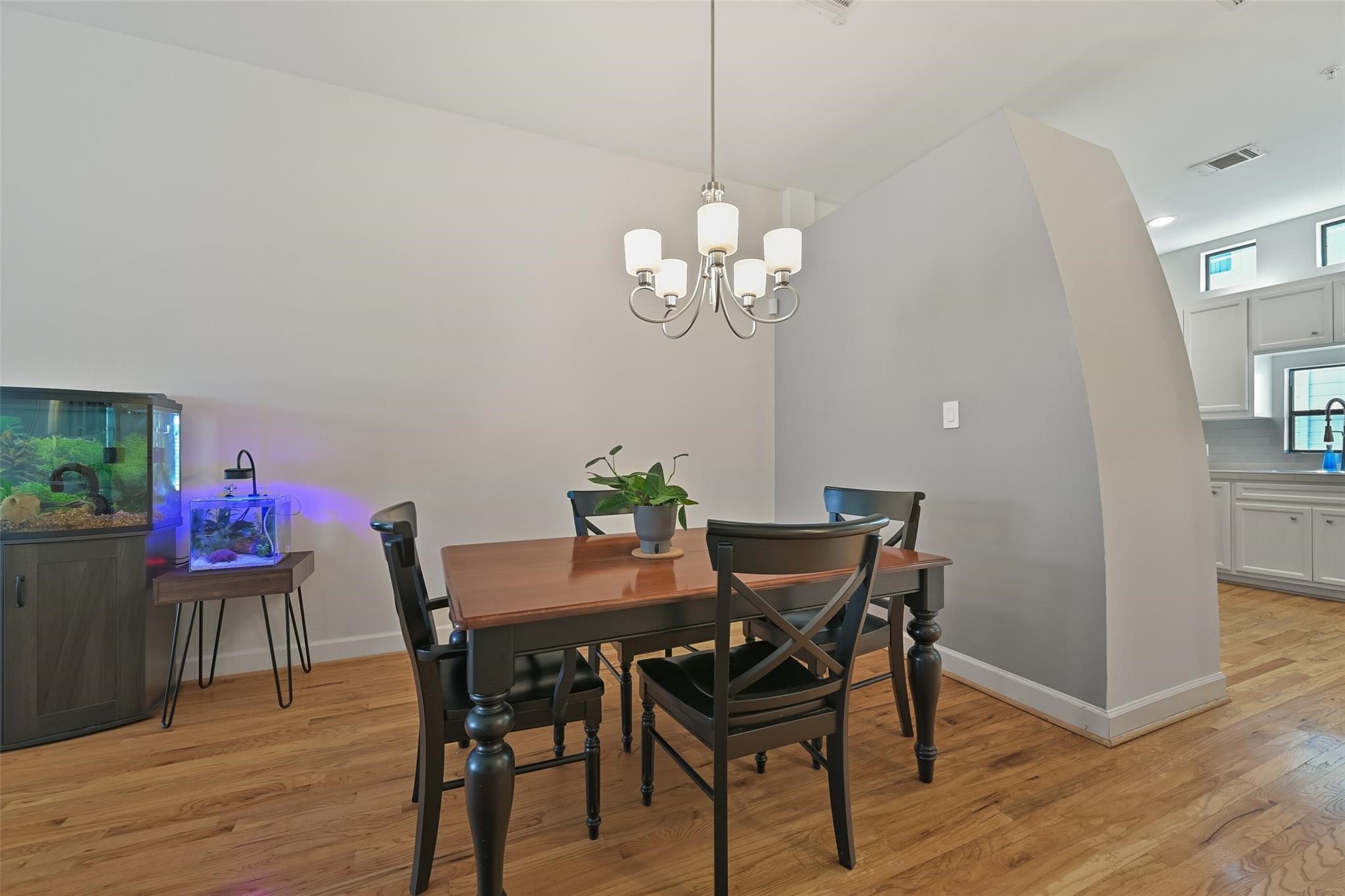 8715 Meadowcroft Drive, Unit 1002 Houston, TX 77063 - Photo 8 of 24 a view of a dining room with furniture and wooden floor