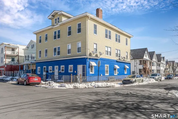 a front view of a building with street view