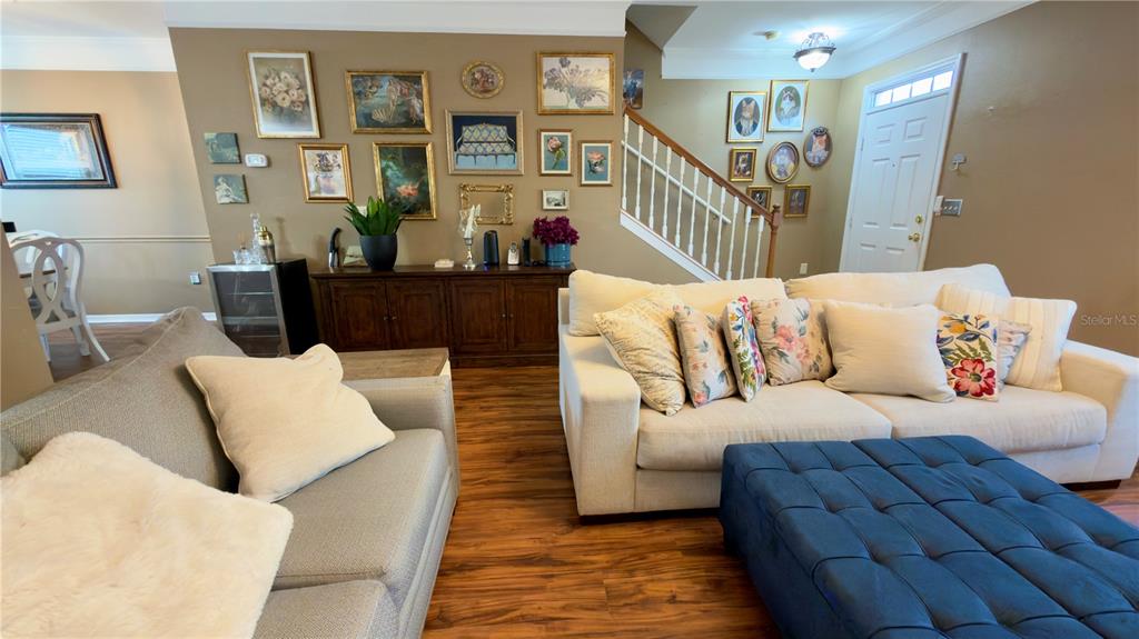 6624 Time Square Avenue, Unit 102 Orlando, FL 32835 - Photo 11 of 96 a living room with furniture and a couch