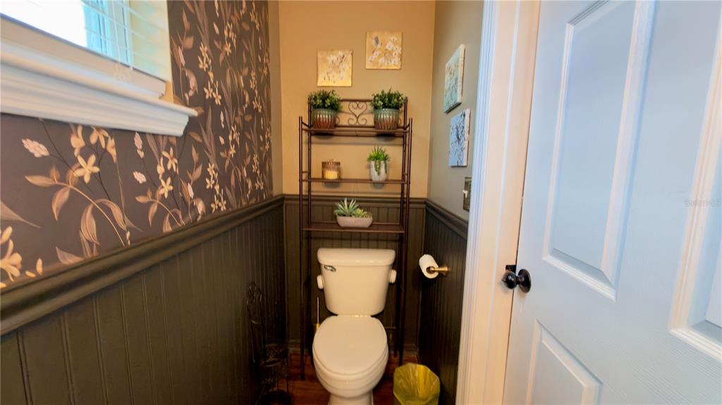 6624 Time Square Avenue, Unit 102 Orlando, FL 32835 - Photo 30 of 96 a bathroom with a toilet and a sink