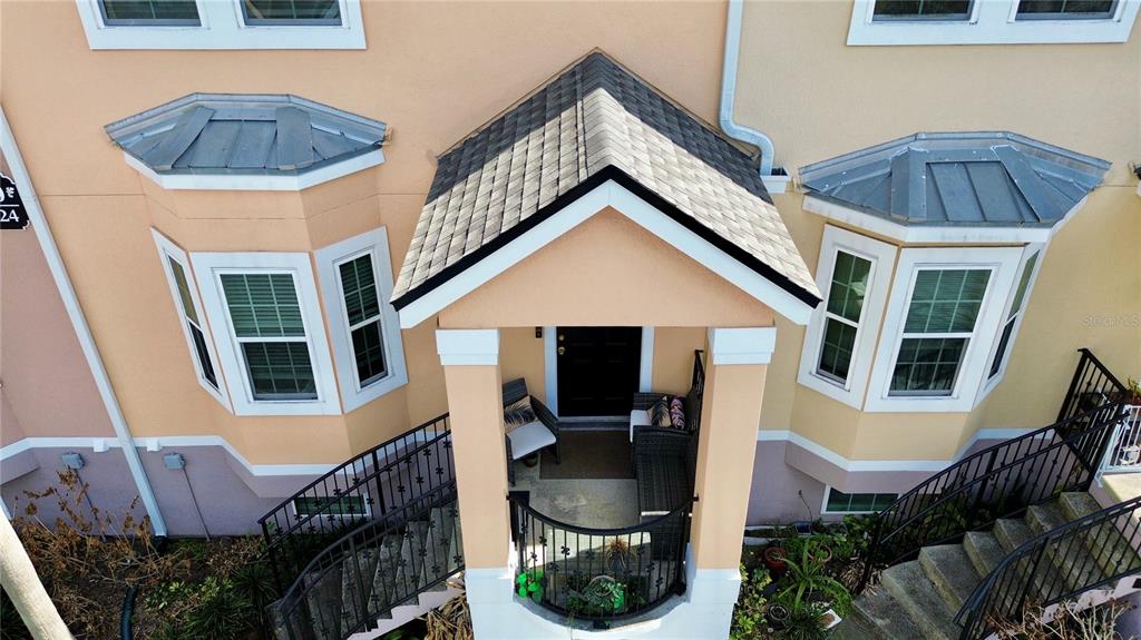 6624 Time Square Avenue, Unit 102 Orlando, FL 32835 - Photo 3 of 96 a front view of a house with yard and seating space