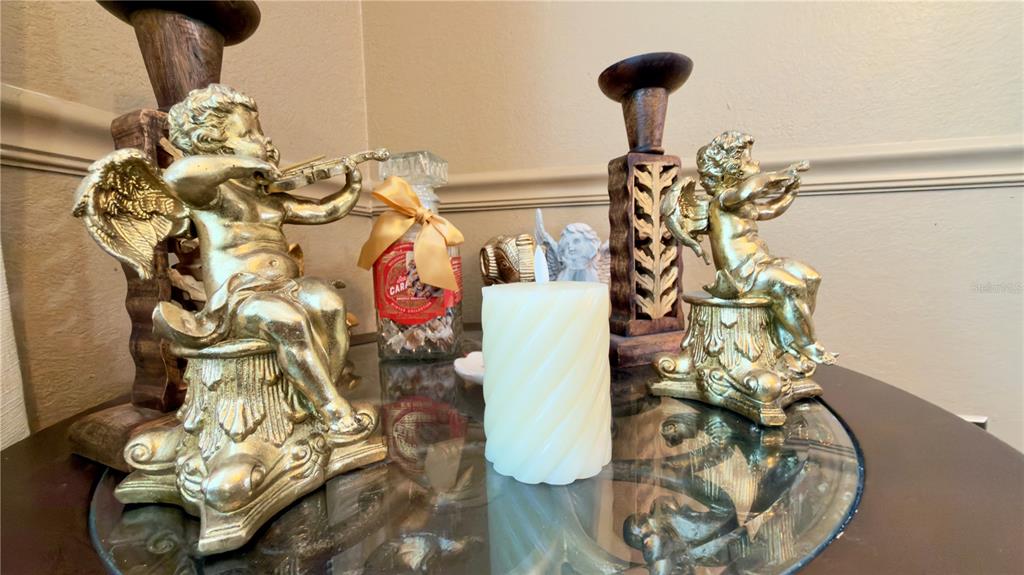 6624 Time Square Avenue, Unit 102 Orlando, FL 32835 - Photo 38 of 96 a vase of flowers sitting on a table with wooden floor