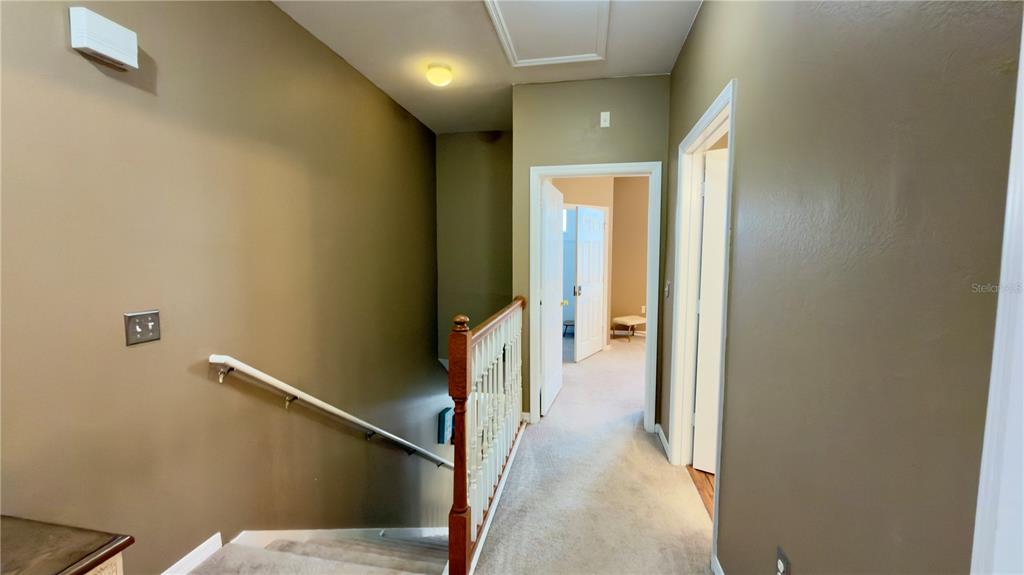 6624 Time Square Avenue, Unit 102 Orlando, FL 32835 - Photo 56 of 96 a view of a hallway with wooden floor