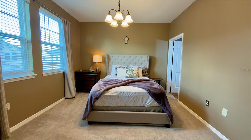 6624 Time Square Avenue, Unit 102 Orlando, FL 32835 - Photo 62 of 96 a bedroom with a bed and window