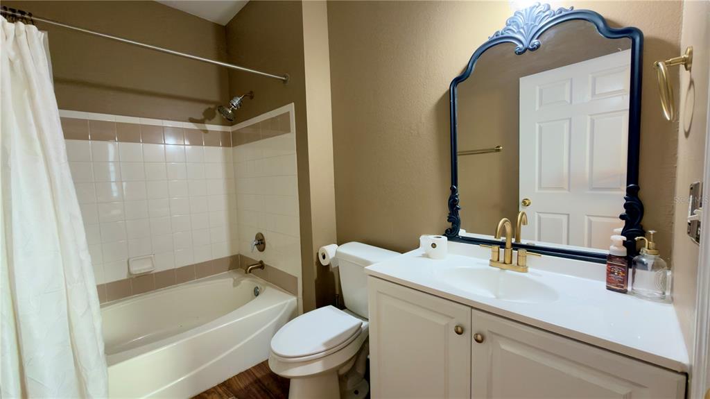 6624 Time Square Avenue, Unit 102 Orlando, FL 32835 - Photo 68 of 96 a bathroom with a sink a toilet and shower