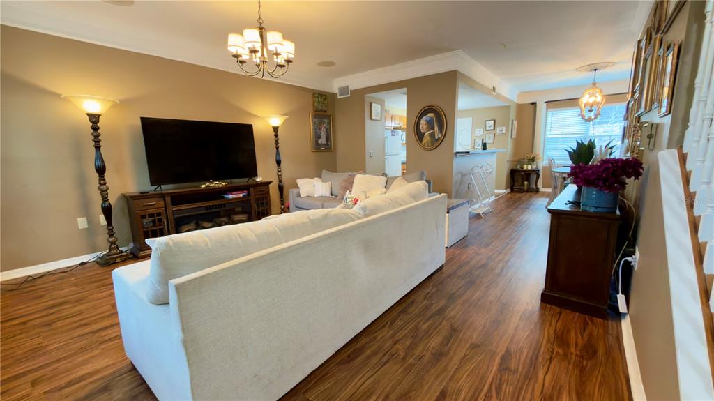 6624 Time Square Avenue, Unit 102 Orlando, FL 32835 - Photo 8 of 96 a living room with furniture and a flat screen tv
