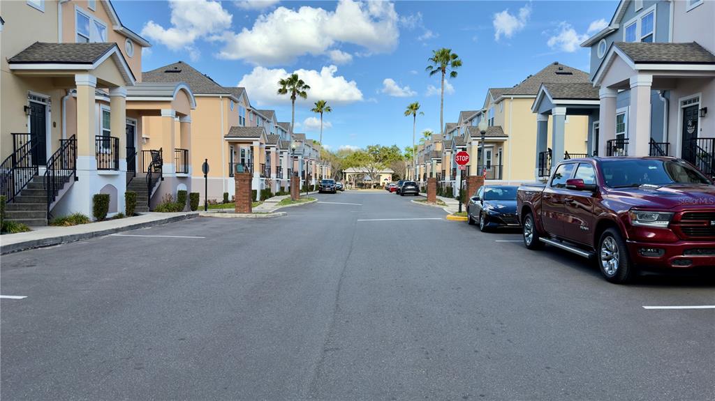 6624 Time Square Avenue, Unit 102 Orlando, FL 32835 - Photo 86 of 96 a view of a cars park in front of a building