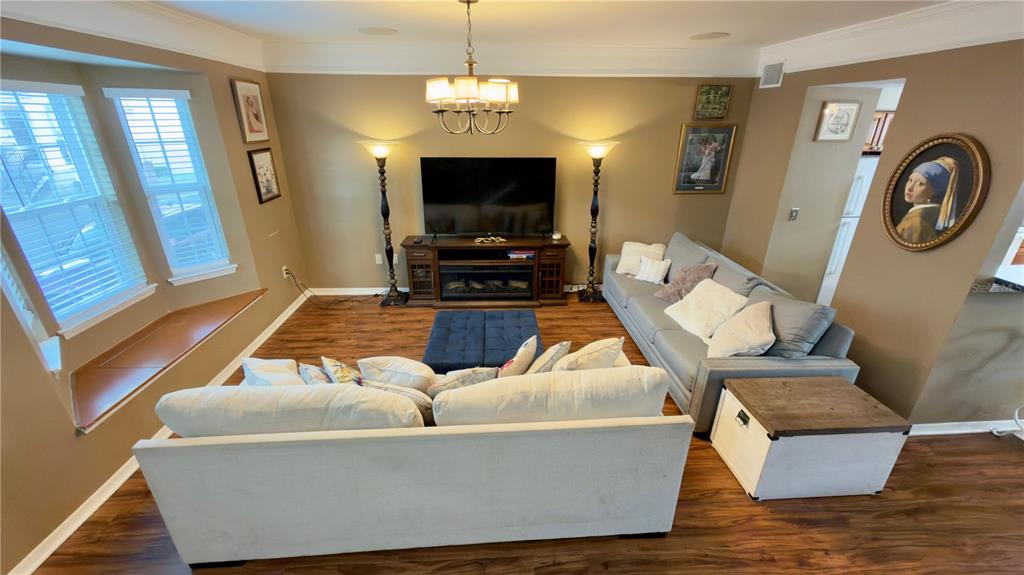 6624 Time Square Avenue, Unit 102 Orlando, FL 32835 - Photo 9 of 96 a living room with furniture and a flat screen tv