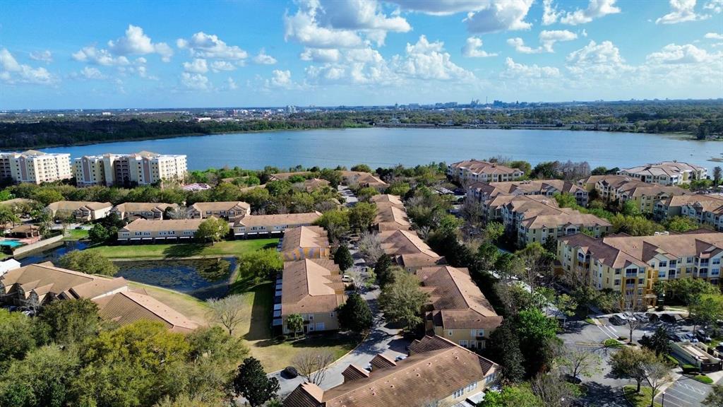 6624 Time Square Avenue, Unit 102 Orlando, FL 32835 - Photo 93 of 96 an aerial view of a house with a lake view
