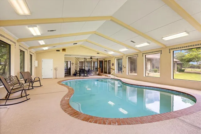 a view of a chairs and table in the patio