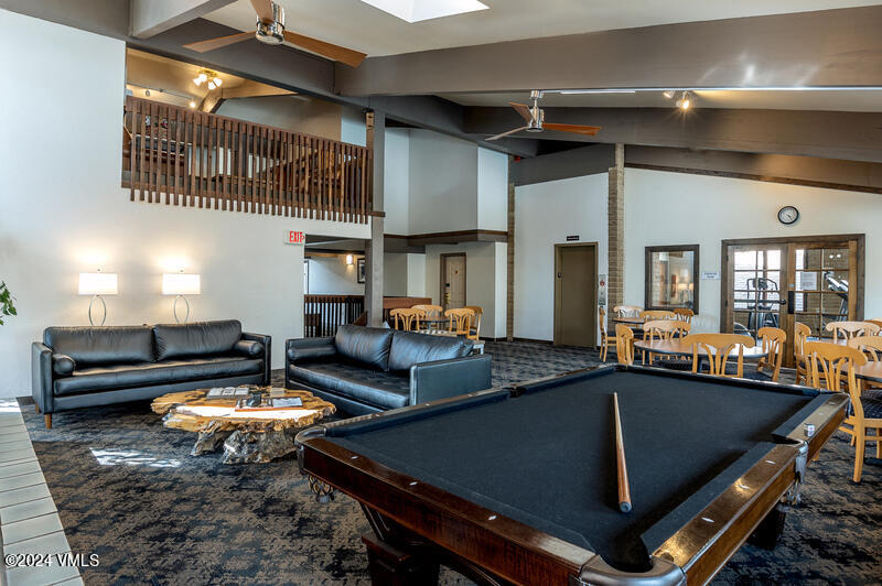 1020 Vail View Drive, Unit 120412 Vail, CO 81657 - Photo 13 of 23 a living room with furniture pool table and a window