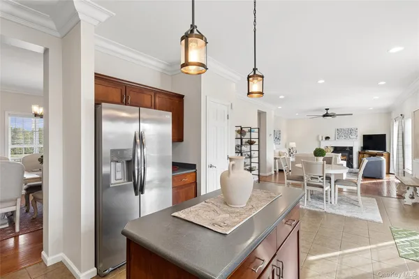 a large kitchen with a table and chairs