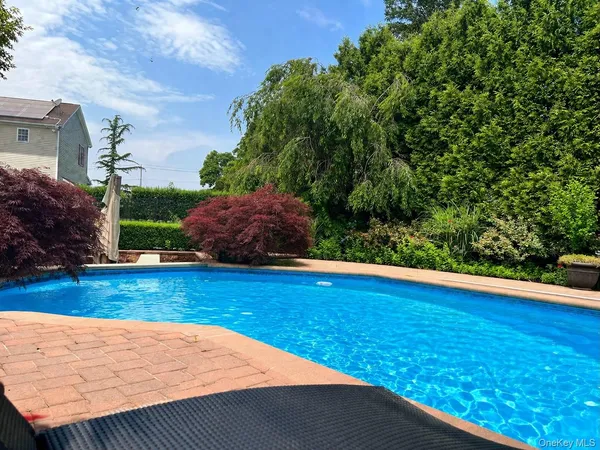 a view of a swimming pool and deck