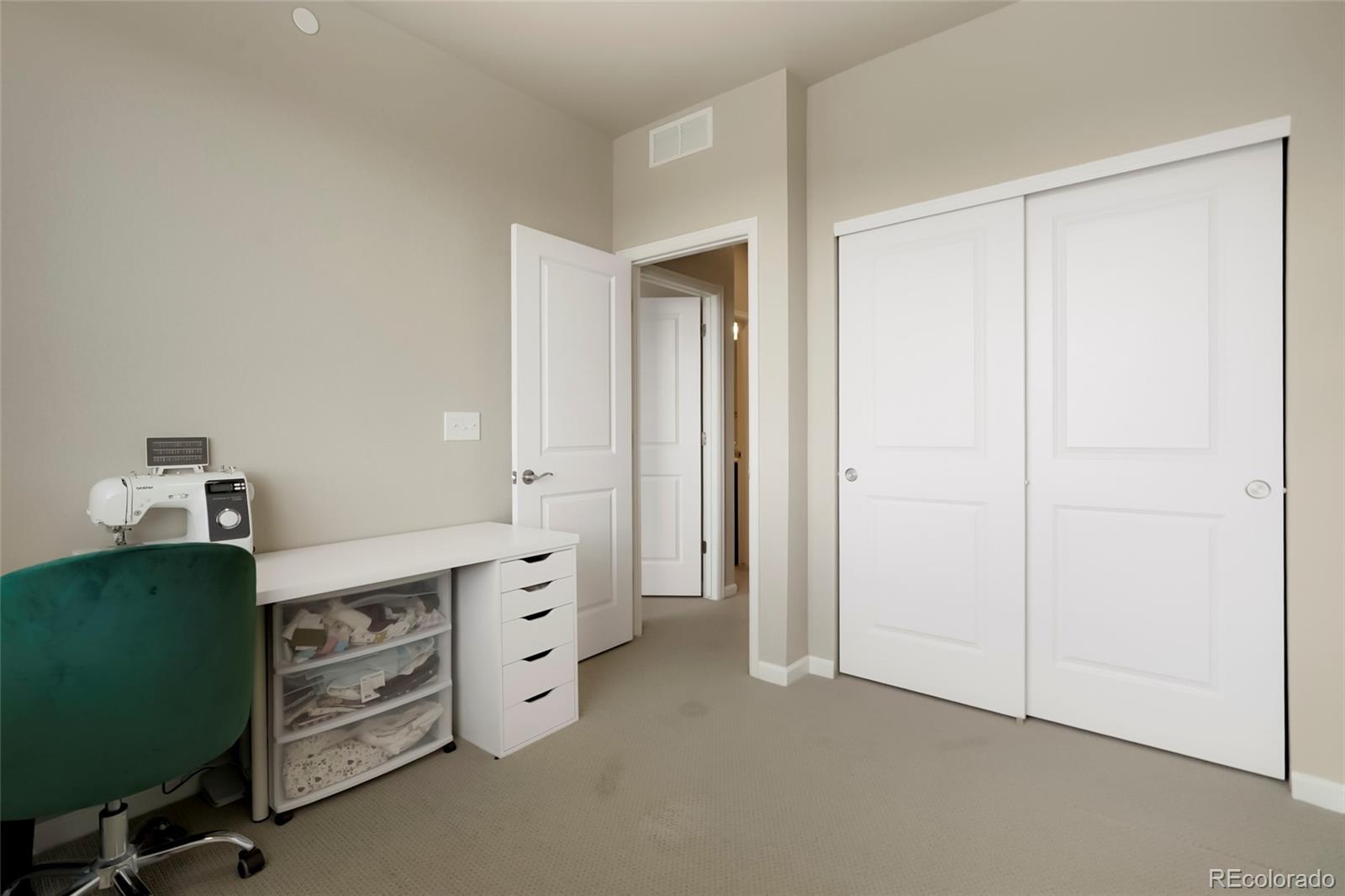 6974 Merseyside Lane Castle Pines, CO 80108 - Photo 14 of 27 a view of a bedroom with cabinets