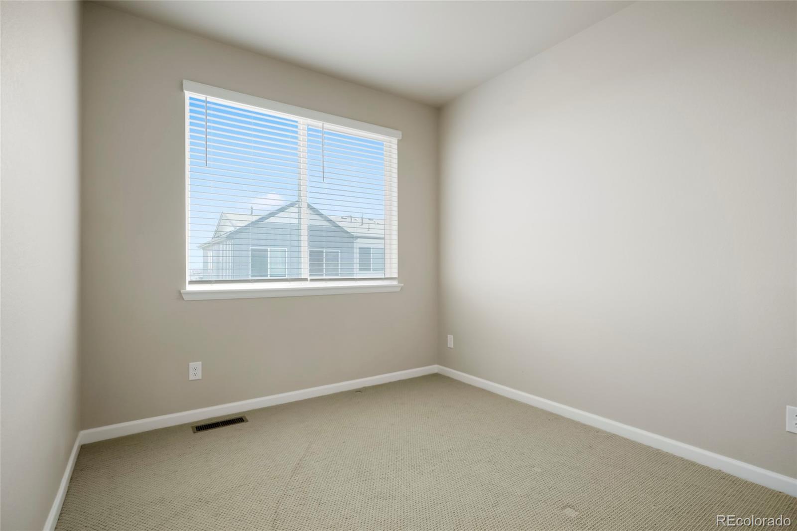 6974 Merseyside Lane Castle Pines, CO 80108 - Photo 16 of 27 an empty room with a window