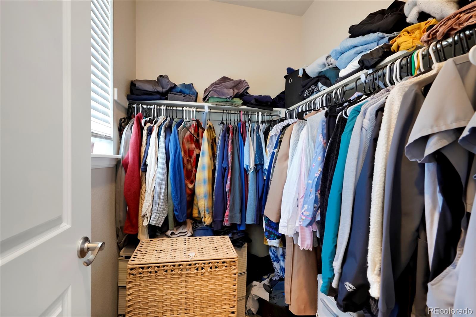 6974 Merseyside Lane Castle Pines, CO 80108 - Photo 19 of 27 a view of walk in closet with clothes