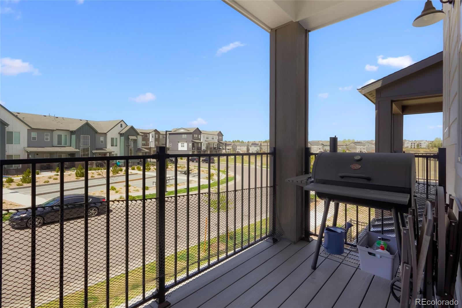 6974 Merseyside Lane Castle Pines, CO 80108 - Photo 22 of 27 a view of a balcony with wooden floor