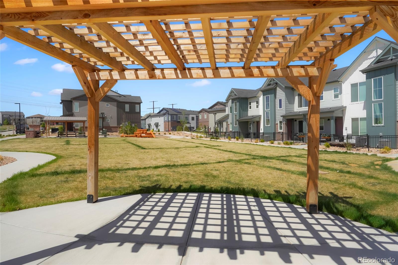 6974 Merseyside Lane Castle Pines, CO 80108 - Photo 26 of 27 a view of a chairs and bench on the sidewalk